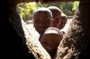 Children peer into a window of the village church in Jessey, Chikwawa.