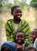 A young girl smiles with other children in the village of Chinamvuu in Balaka.