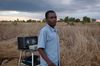 Fexton Manja observes as the final preparations for the Jesus film are made.