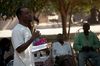 Snoya Liwonde preaches in front of the village of Singano in the region of Chikwawa.