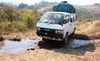 Near the mountain village of Doviko, villagers placed large bricks in a canal for the team to cross.