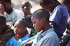 Children pray after hearing a sermon about Christ bridging the gap between God and man.