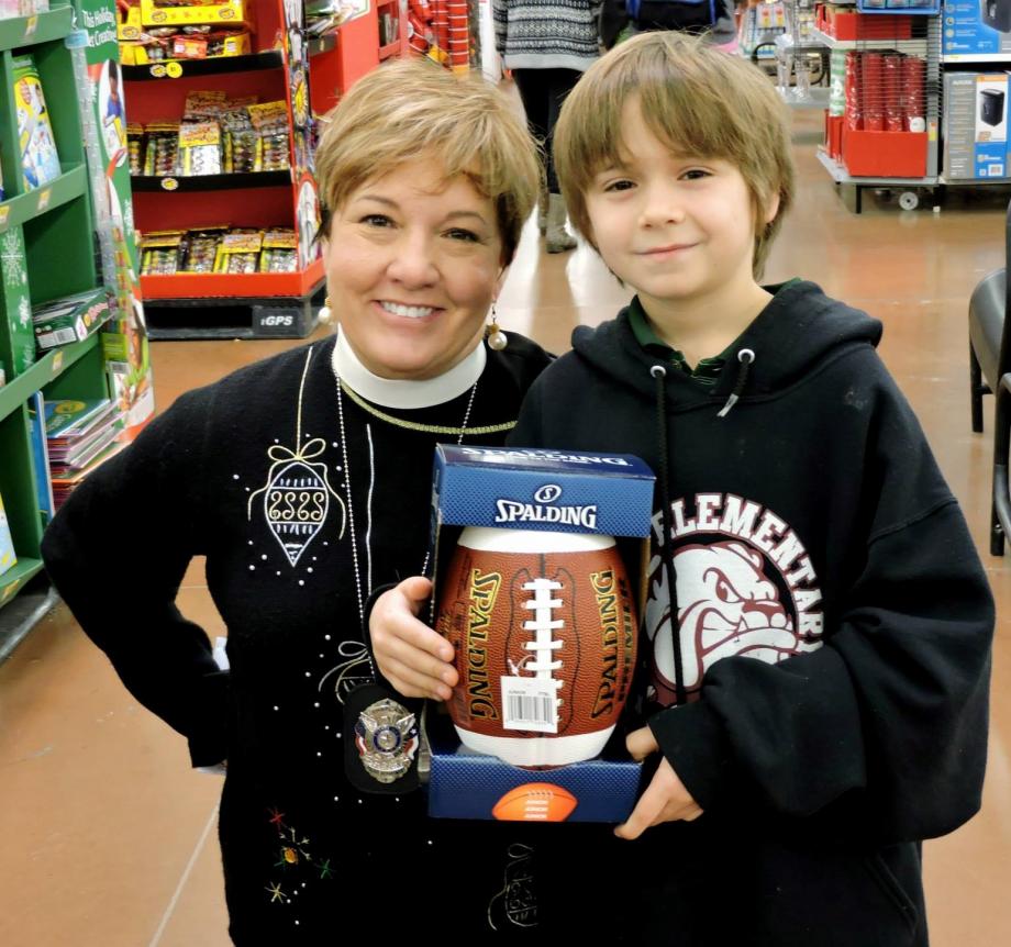 Pastor Jennifer helps with Buda PD's Blue Santa event