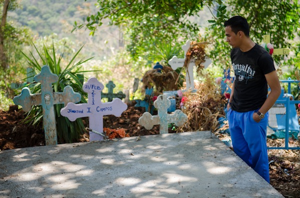 Daniel Cuellar, 18, visits the gravesite of his most recent friend to die as a result of the violence in El Salvador.